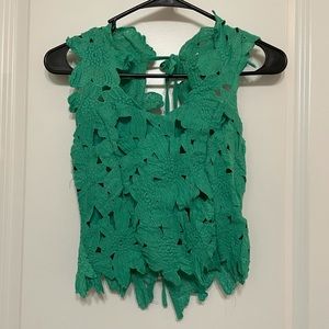 Embroidered green top.